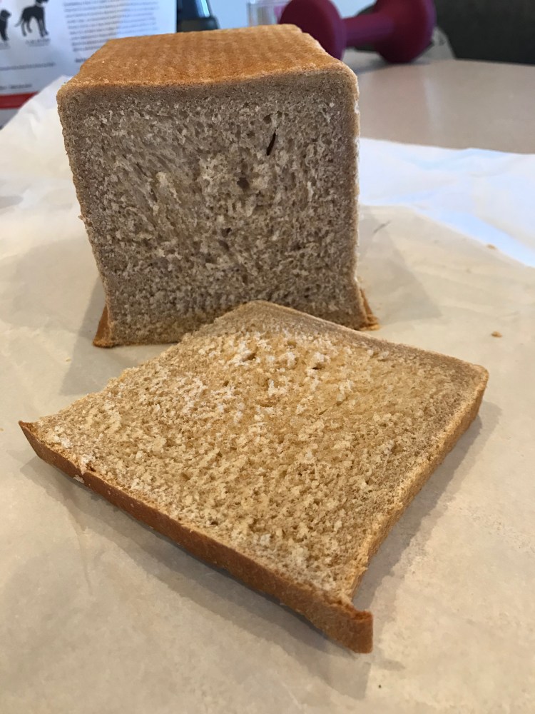 Loaf of bread with cut out slice 